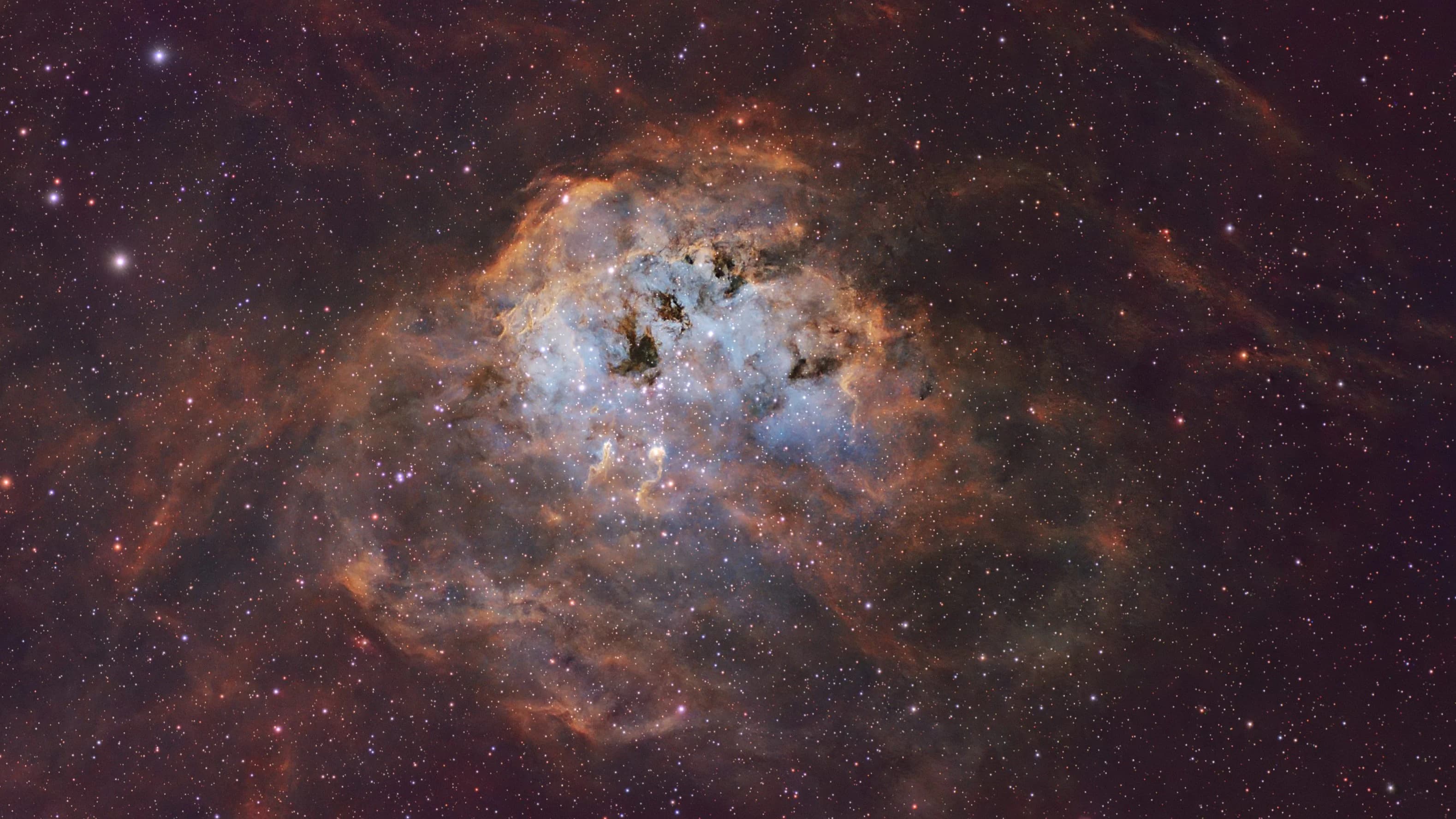 High-resolution narrowband SHO integration of the Tadpole Nebula (IC 410)in Auriga, showcasing dense star-forming gas clouds and internal dusty filaments.